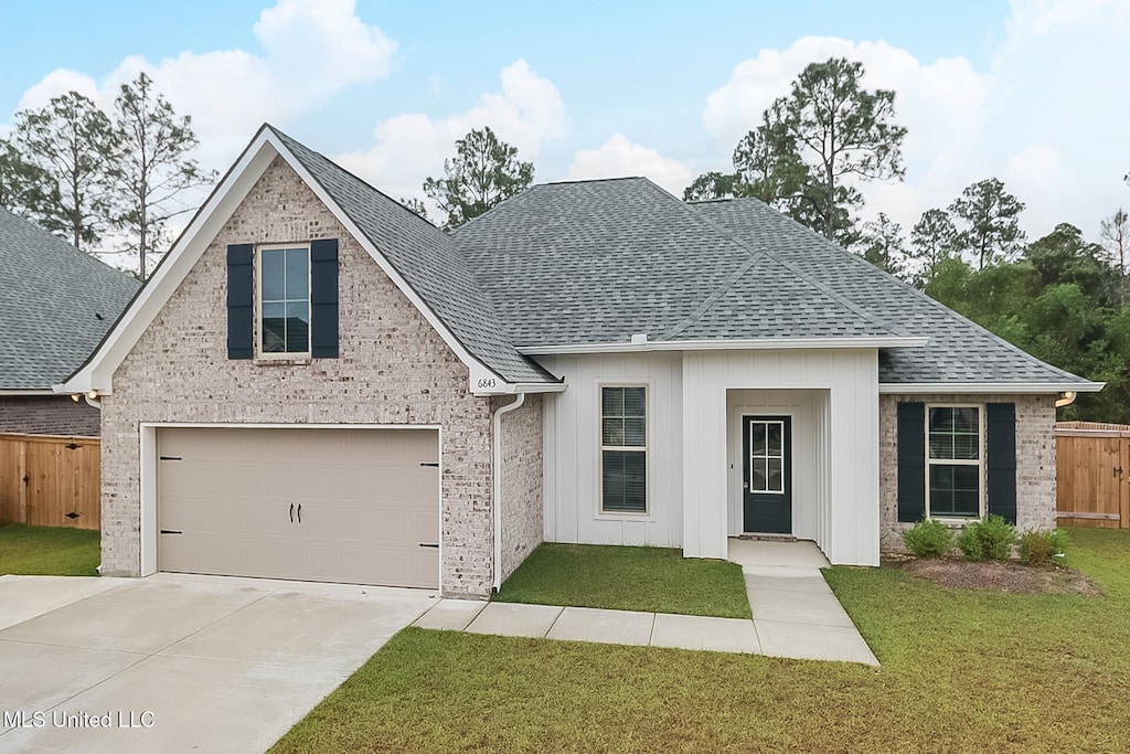 view of front of property featuring a shingled roof, brick siding, concrete driveway, and a garage