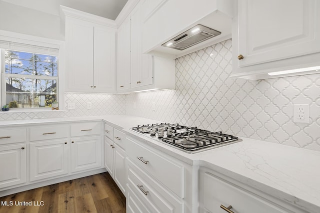 kitchen featuring stainless steel gas cooktop, dark wood-type flooring, custom exhaust hood, and white cabinets