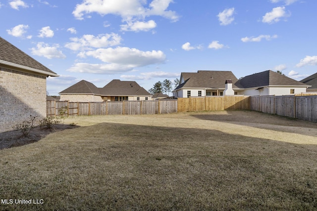 view of yard with a fenced backyard