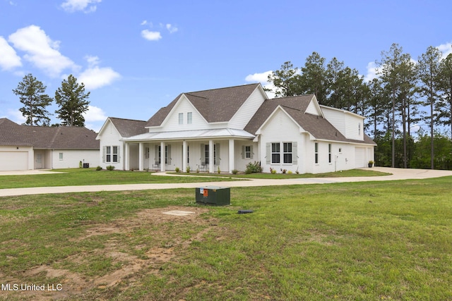 modern farmhouse featuring roof with shingles, concrete driveway, covered porch, and a front lawn