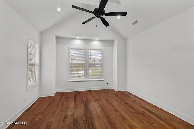 spare room with ceiling fan, visible vents, wood finished floors, lofted ceiling, and baseboards