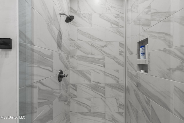 interior details featuring a shower stall
