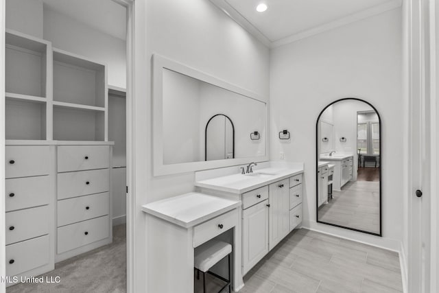 full bathroom featuring crown molding and vanity