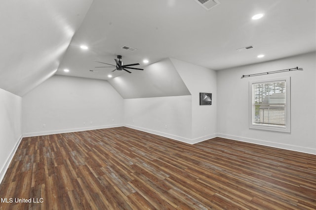 additional living space with dark wood-style flooring and visible vents
