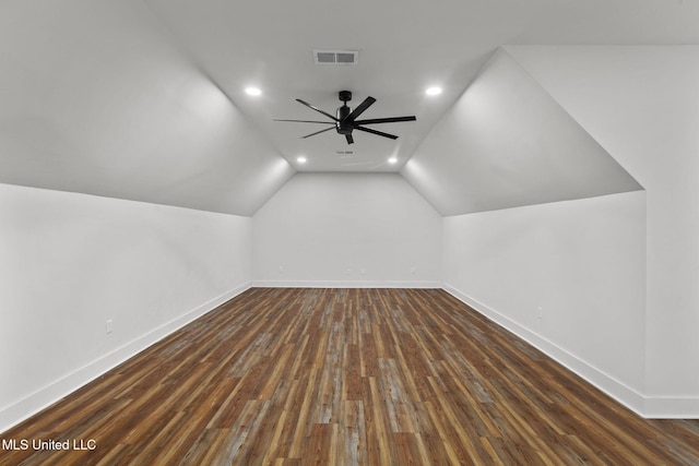 bonus room with baseboards, vaulted ceiling, a ceiling fan, dark wood-type flooring, and visible vents