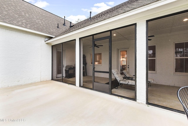 view of patio featuring a sunroom