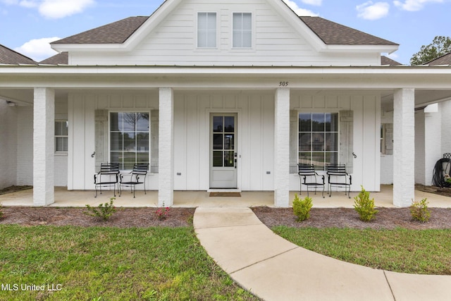view of front of house featuring roof with shingles, a porch, and board and batten siding