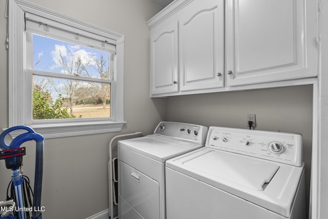 laundry area featuring cabinet space and washer and clothes dryer