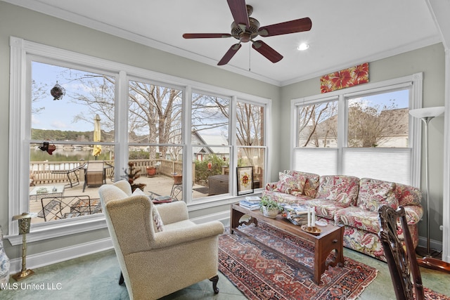 sunroom featuring a ceiling fan