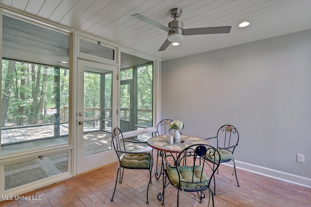 1844 Eastover Dr, Jackson, MS 39211 - sunroom / solarium featuring baseboards, a wall of windows, plenty of natural light, and brick floor
