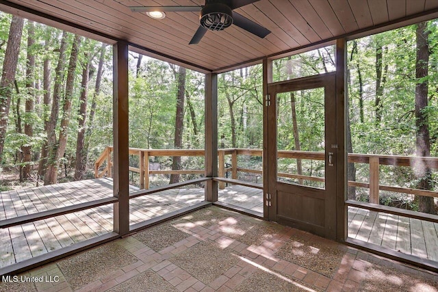 1844 Eastover Dr, Jackson, MS 39211 - unfurnished sunroom with a healthy amount of sunlight, a forest view, and ceiling fan