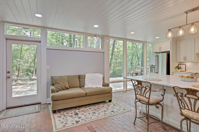 1844 Eastover Dr, Jackson, MS 39211 - living room featuring recessed lighting, a wealth of natural light, and brick floor