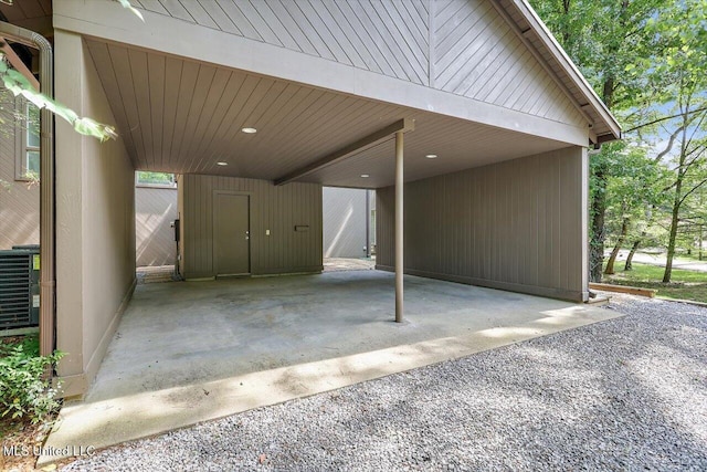 1844 Eastover Dr, Jackson, MS 39211 - view of patio featuring a carport, central AC, and gravel driveway
