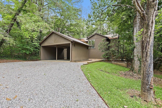 1844 Eastover Dr, Jackson, MS 39211 - view of front of house featuring a carport and gravel driveway