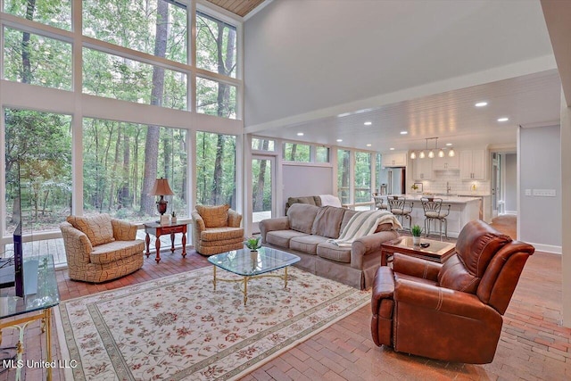 1844 Eastover Dr, Jackson, MS 39211 - living area with recessed lighting, a high ceiling, and a wealth of natural light