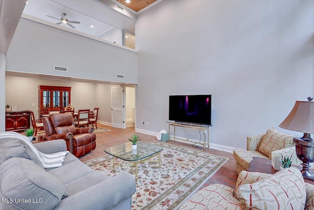 1844 Eastover Dr, Jackson, MS 39211 - living room with baseboards, ceiling fan, visible vents, and wood finished floors