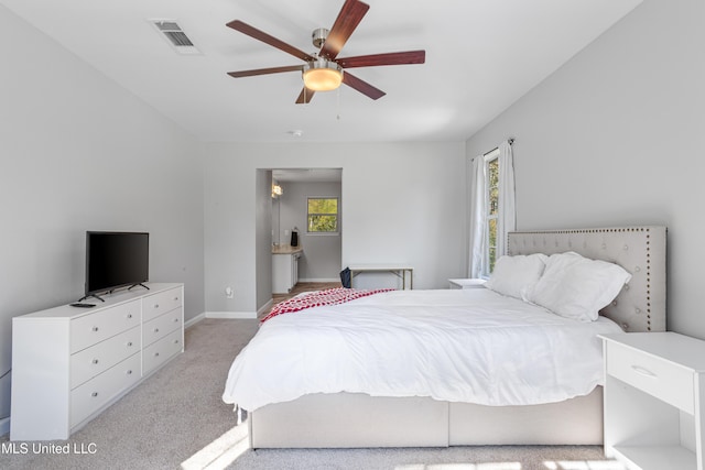 carpeted bedroom featuring ceiling fan