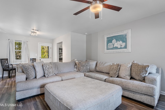 2869 Honduras Dr, Gautier, MS 39553 - living area featuring a ceiling fan and dark wood-type flooring