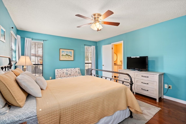 bedroom featuring baseboards, a textured ceiling, wood finished floors, and a ceiling fan