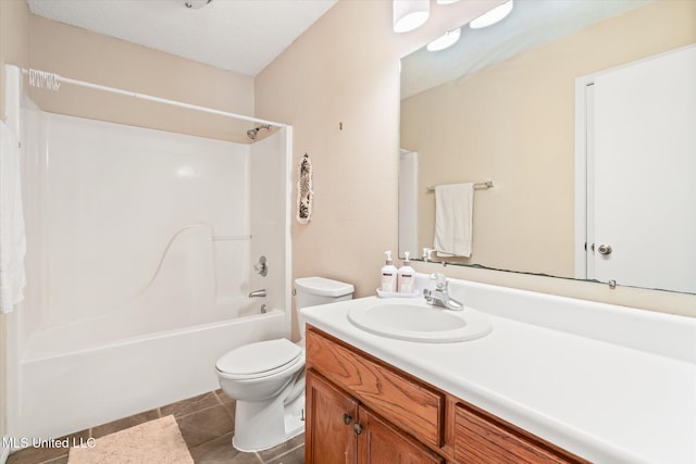 full bath with vanity, tile patterned floors, toilet, and shower / bathtub combination