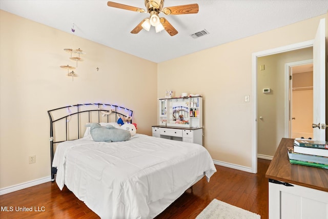 bedroom with a ceiling fan, dark wood-type flooring, baseboards, and visible vents