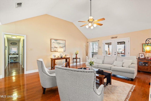 living area with visible vents, a ceiling fan, wood finished floors, french doors, and baseboards