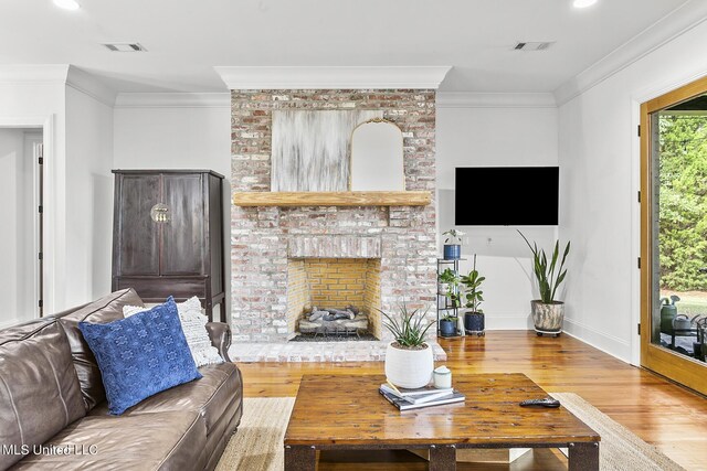 101 Lake Village Dr, Madison, MS 39110 - living room with ornamental molding, wood finished floors, and visible vents