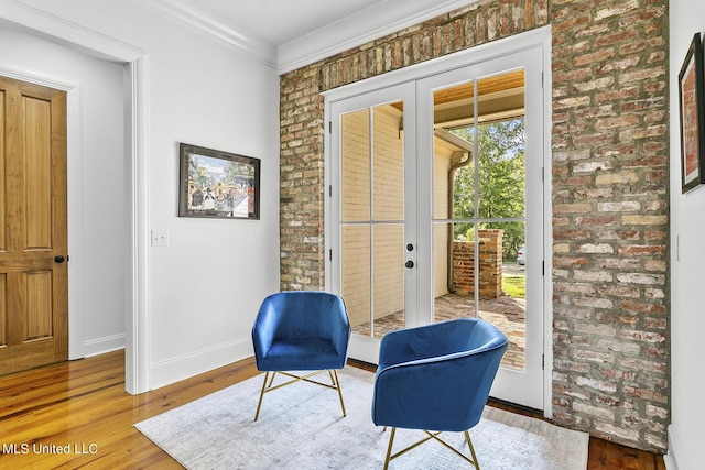 101 Lake Village Dr, Madison, MS 39110 - sitting room featuring french doors, baseboards, wood finished floors, and brick wall