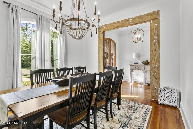 101 Lake Village Dr, Madison, MS 39110 - dining room with crown molding, a notable chandelier, wood finished floors, and baseboards