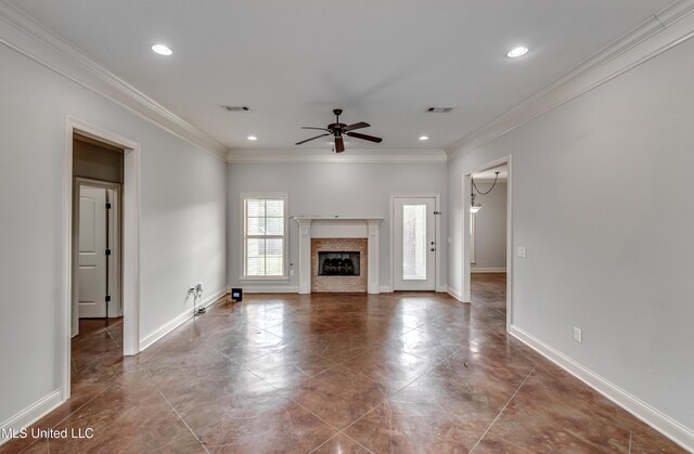 unfurnished living room with baseboards, ceiling fan, and crown molding
