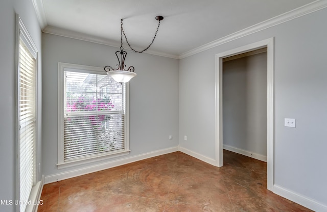 unfurnished dining area featuring baseboards, concrete floors, and crown molding