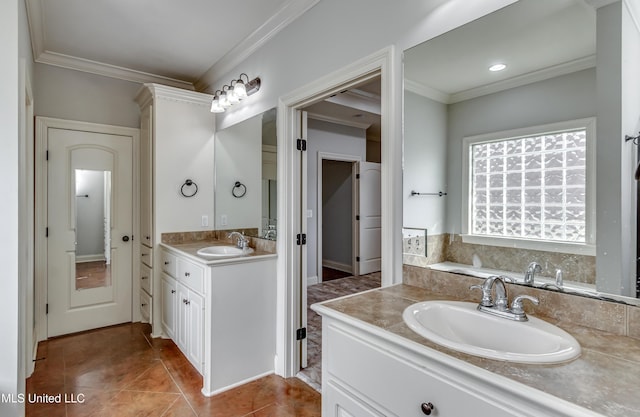 full bath with tile patterned floors, vanity, crown molding, and a garden tub