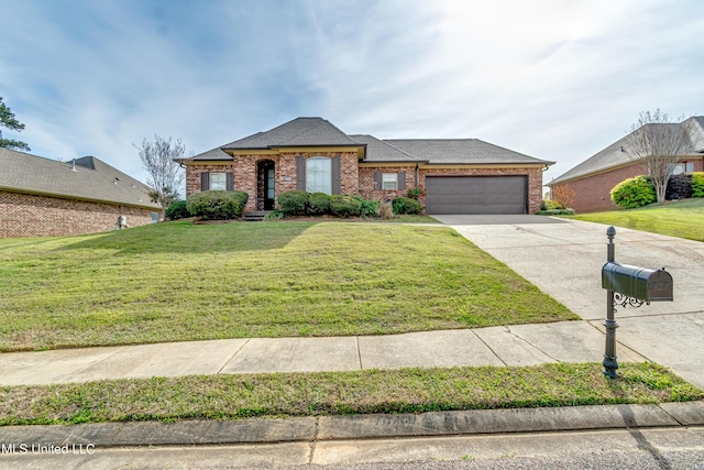view of front facade with a front lawn, driveway, an attached garage, and brick siding