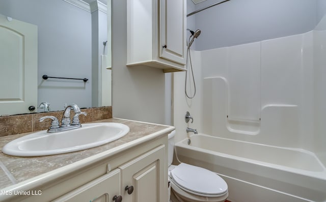bathroom featuring toilet, vanity, and shower / bathing tub combination