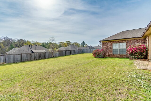 view of yard featuring a fenced backyard