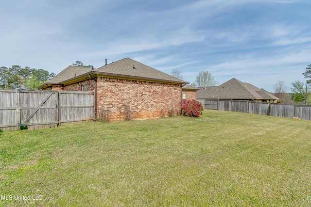 view of yard featuring a fenced backyard