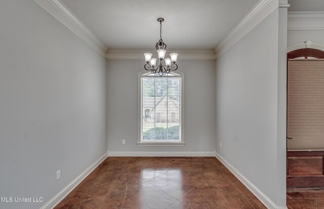 spare room featuring tile patterned floors, crown molding, baseboards, and a chandelier