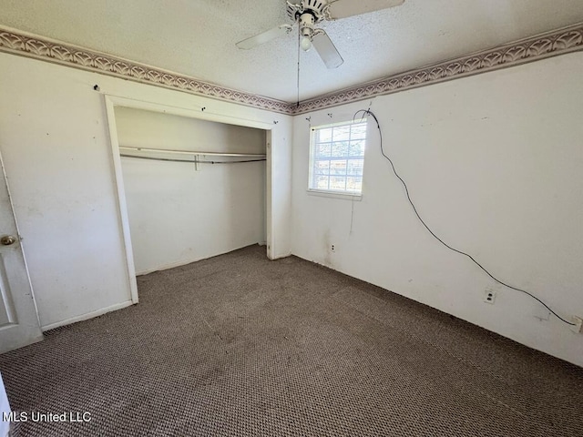 208 Cedar Dr, Diberville, MS 39540 - unfurnished bedroom featuring carpet flooring, a closet, ceiling fan, and a textured ceiling