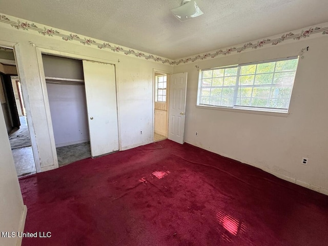 208 Cedar Dr, Diberville, MS 39540 - unfurnished bedroom featuring a textured ceiling and carpet flooring