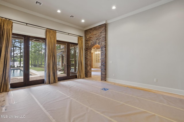 spare room with ornamental molding, visible vents, french doors, and recessed lighting