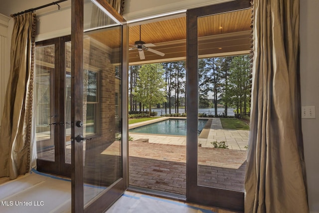 doorway to outside with ceiling fan, a water view, wood ceiling, and french doors