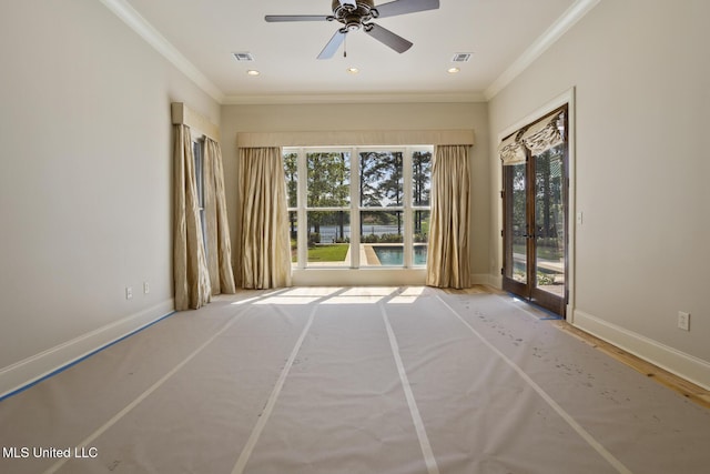 spare room featuring ceiling fan, visible vents, french doors, and ornamental molding