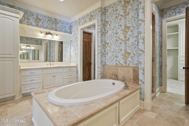 full bathroom featuring crown molding, a bath, and wallpapered walls