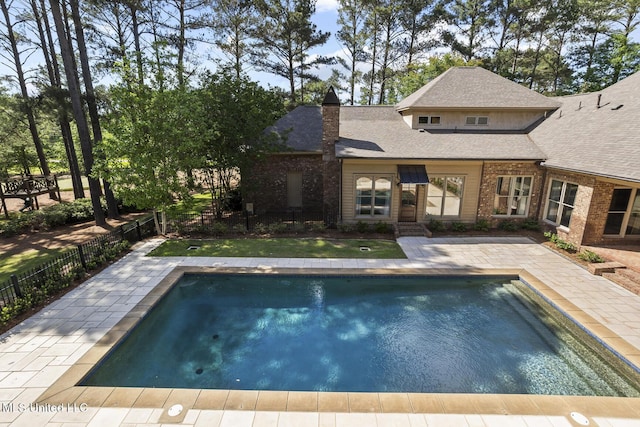 view of swimming pool featuring a patio, fence private yard, and a fenced in pool