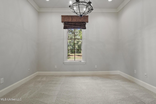 spare room with crown molding, light carpet, baseboards, and an inviting chandelier