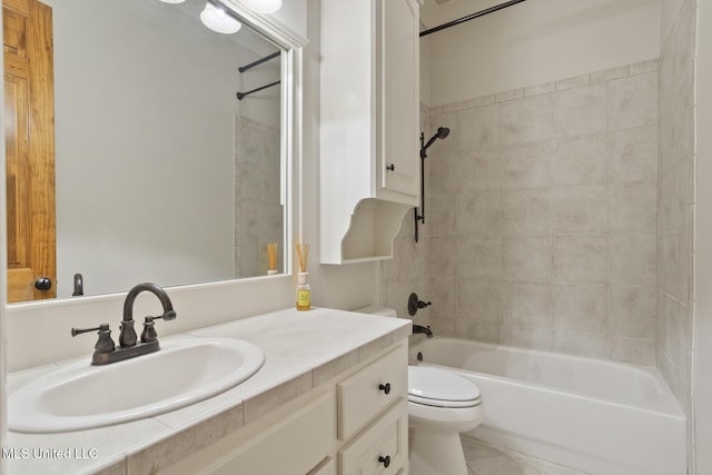 bathroom featuring toilet, tile patterned floors, vanity, and bathtub / shower combination
