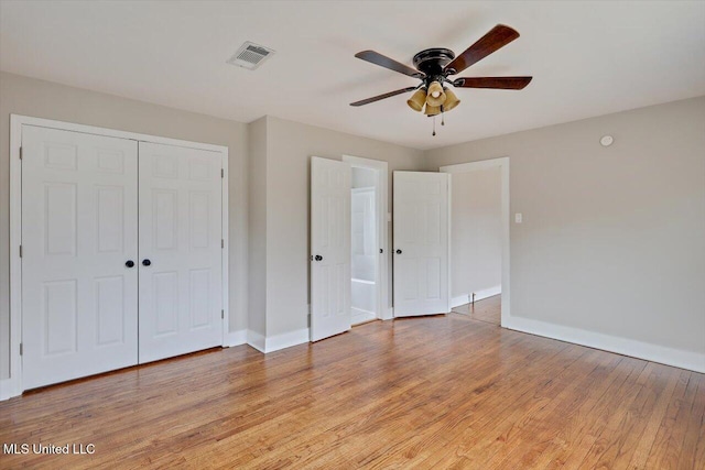 127 Autumn Dr, Vicksburg, MS 39180 - unfurnished bedroom featuring baseboards, visible vents, a ceiling fan, light wood-style floors, and a closet
