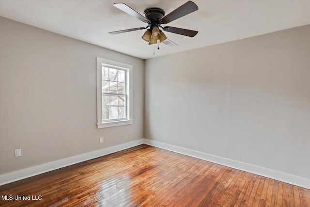 127 Autumn Dr, Vicksburg, MS 39180 - unfurnished room featuring visible vents, ceiling fan, baseboards, and hardwood / wood-style flooring
