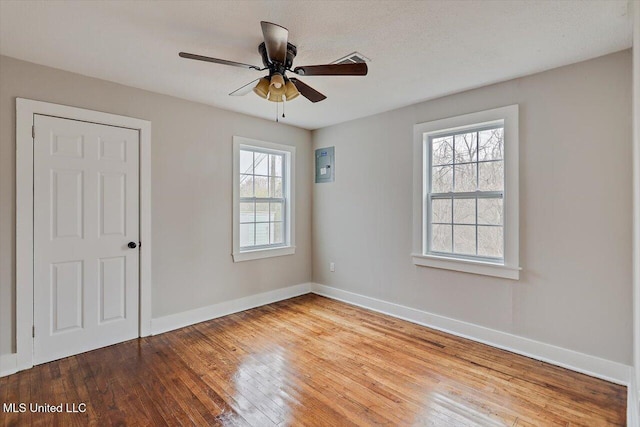 127 Autumn Dr, Vicksburg, MS 39180 - unfurnished room with a ceiling fan, electric panel, hardwood / wood-style flooring, and baseboards