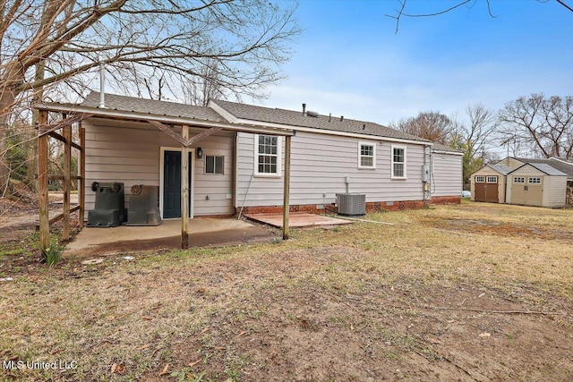 127 Autumn Dr, Vicksburg, MS 39180 - rear view of house featuring a storage shed, a patio, crawl space, an outdoor structure, and central air condition unit
